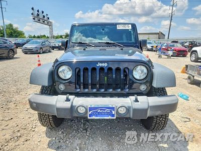 Piąte zdjęcie samochodu w środku: 2015 JEEP WRANGLER UNLIMITED SPORT VIN:1C4BJWDG1FL682801 - miniatura