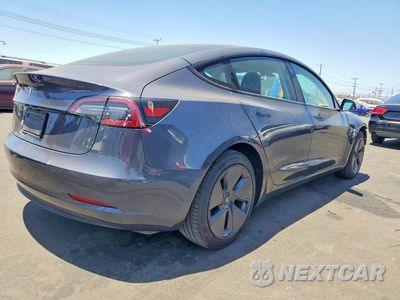 Trzecie zdjęcie samochodu z tyłu: 2023 TESLA MODEL 3 VIN:5YJ3E1EA1PF401140 - miniatura