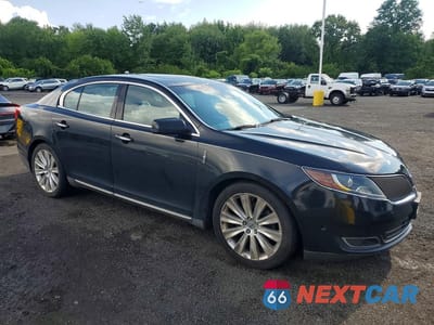 Czwarte zdjęcie samochodu z boku: 2014 LINCOLN MKS VIN:1LNHL9FT3EG600067 - miniatura