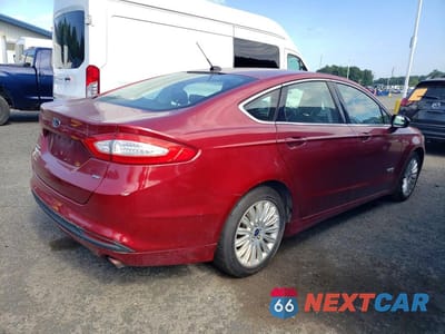 Trzecie zdjęcie samochodu z tyłu: 2014 FORD FUSION SE PHEV VIN:3FA6P0PU2ER382625 - miniatura