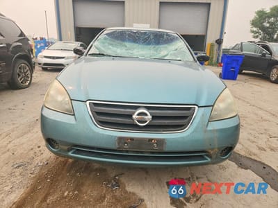 Piąte zdjęcie samochodu w środku: 2002 NISSAN ALTIMA 2.5 VIN:1N4AL11D52C702342 - miniatura