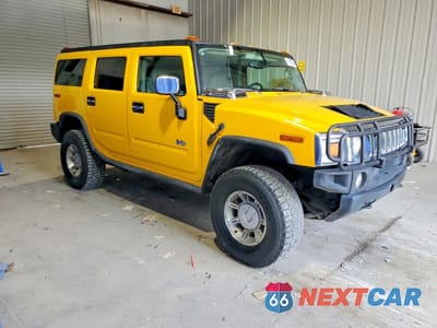 Czwarte zdjęcie samochodu z boku: 2003 HUMMER H2 VIN:5GRGN23U83H141588 - miniatura
