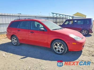 Czwarte zdjęcie samochodu z boku: 2002 FORD FOCUS SE VIN:1FAFP36372W150699 - miniatura