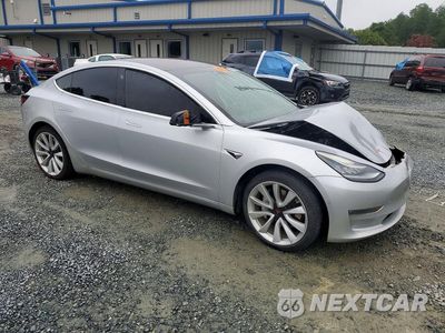 Czwarte zdjęcie samochodu z boku: 2018 TESLA MODEL 3 VIN:5YJ3E1EA3JF050013 - miniatura