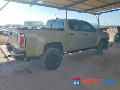 Trzecie zdjęcie samochodu z tyłu: 2022 GMC CANYON AT4 VIN:1GTG6FEN4N1215564 - miniatura