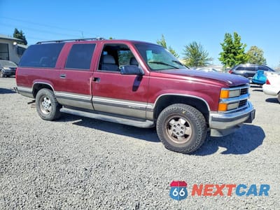 Czwarte zdjęcie samochodu z boku: 1999 CHEVROLET SUBURBAN K1500 VIN:3GNFK16R9XG194038 - miniatura