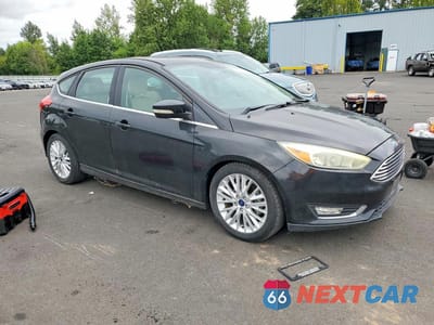 Czwarte zdjęcie samochodu z boku: 2015 FORD FOCUS TITANIUM VIN:1FADP3N22FL222111 - miniatura