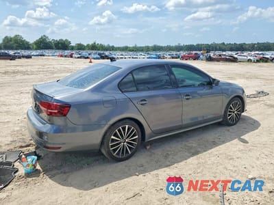 Trzecie zdjęcie samochodu z tyłu: 2016 VOLKSWAGEN JETTA SPORT VIN:3VWD17AJ0GM399236 - miniatura