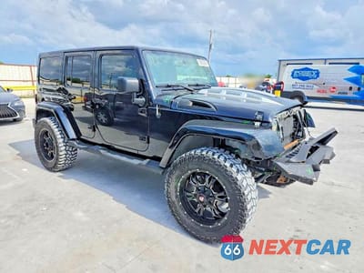 Czwarte zdjęcie samochodu z boku: 2013 JEEP WRANGLER UNLIMITED SAHARA VIN:1C4BJWEG5DL503168 - miniatura