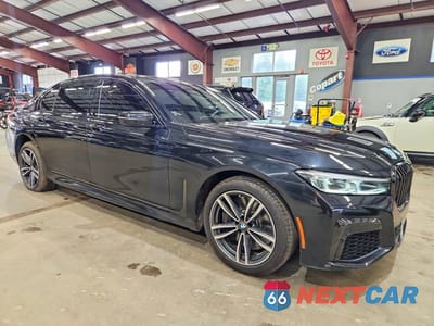 Czwarte zdjęcie samochodu z boku: 2021 BMW 750 XI VIN:WBA7U2C07MCF68499 - miniatura