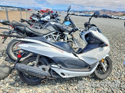 2011 HONDA PCX MLHJF2807B5001491 - główne zdjęcie licytacji z USA - miniatura