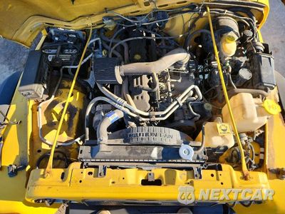Zdjęcie 11 z 12 samochodu: 2000 JEEP WRANGLER / TJ SPORT VIN:1J4FA49S1YP774452 - miniatura