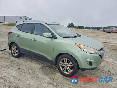 Czwarte zdjęcie samochodu z boku: 2011 HYUNDAI TUCSON GLS VIN:KM8JU3AC2BU292051 - miniatura