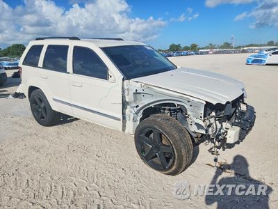 Czwarte zdjęcie samochodu z boku: 2010 JEEP GRAND CHEROKEE LARED VIN:1J4PR4GK2AC150592 - miniatura