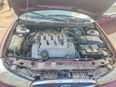 Zdjęcie 11 z 12 samochodu: 1998 FORD CONTOUR LX VIN:3FAFP66LXWM139641 - miniatura