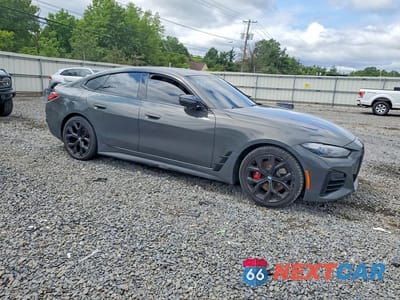 Czwarte zdjęcie samochodu z boku: 2024 BMW M4 M440XI GRAN COUPE VIN:WBA13AW09RFP92293 - miniatura