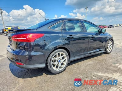 Trzecie zdjęcie samochodu z tyłu: 2015 FORD FOCUS SE VIN:1FADP3F20FL334503 - miniatura