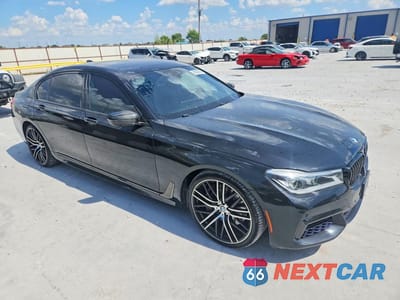 Czwarte zdjęcie samochodu z boku: 2018 BMW 750 I VIN:WBA7F0C56JGM23563 - miniatura