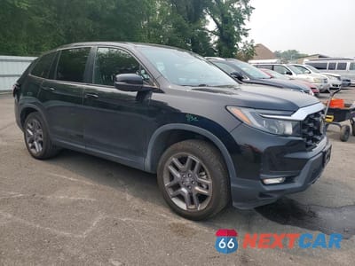 Czwarte zdjęcie samochodu z boku: 2023 HONDA PASSPORT EXL VIN:5FNYF8H56PB039946 - miniatura