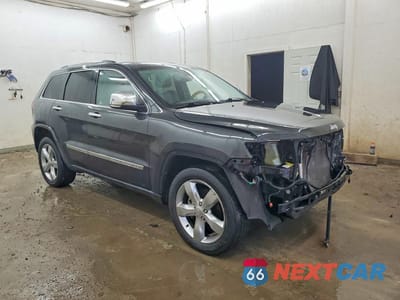 Czwarte zdjęcie samochodu z boku: 2011 JEEP GRAND CHEROKEE OVERLAND VIN:1J4RS6GG6BC719594 - miniatura