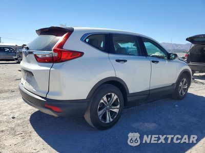 Trzecie zdjęcie samochodu z tyłu: 2018 HONDA CR-V LX VIN:2HKRW5H37JH419890 - miniatura