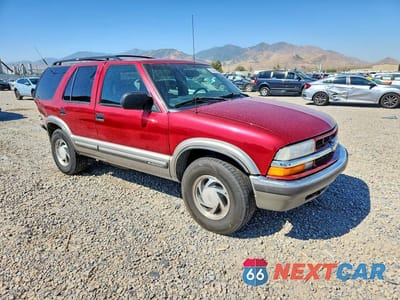 Czwarte zdjęcie samochodu z boku: 2000 CHEVROLET BLAZER VIN:1GNDT13W7Y2385532 - miniatura