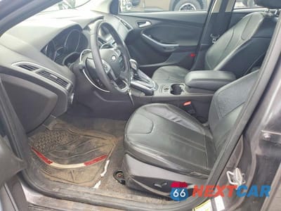 Zdjęcie 7 z 13 samochodu: 2014 FORD FOCUS TITANIUM VIN:1FADP3J27EL101403 - miniatura