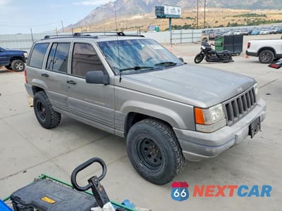 Czwarte zdjęcie samochodu z boku: 1998 JEEP GRAND CHEROKEE LAREDO VIN:1J4GZ58Y2WC157042 - miniatura