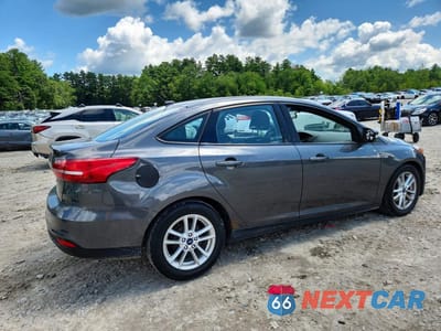 Trzecie zdjęcie samochodu z tyłu: 2016 FORD FOCUS SE VIN:1FADP3F27GL200539 - miniatura