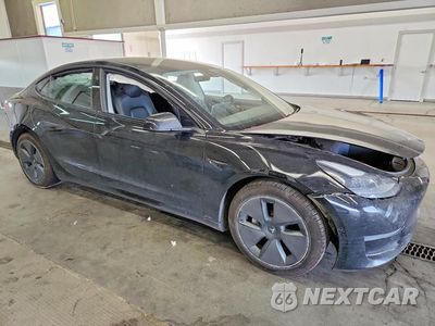 Czwarte zdjęcie samochodu z boku: 2021 TESLA MODEL 3 VIN:5YJ3E1EB6MF999066 - miniatura