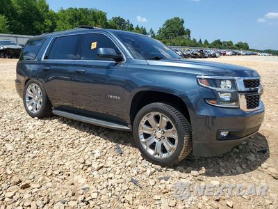 Czwarte zdjęcie samochodu z boku: 2019 CHEVROLET TAHOE C1500 LT VIN:1GNSCBKC4KR187638 - miniatura