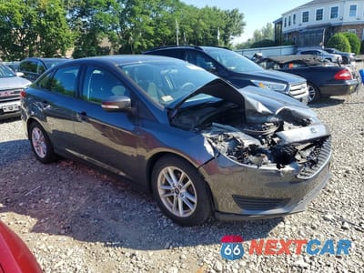Czwarte zdjęcie samochodu z boku: 2017 FORD FOCUS SE VIN:1FADP3F28HL250576 - miniatura