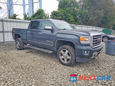Czwarte zdjęcie samochodu z boku: 2017 GMC SIERRA K2500 SLT VIN:1GT12TEG5HF128670 - miniatura