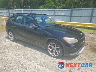 Czwarte zdjęcie samochodu z boku: 2014 BMW X1 SDRIVE28I VIN:WBAVM1C51EVW47215 - miniatura