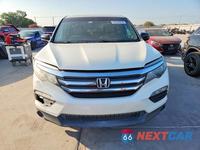 Piąte zdjęcie samochodu w środku: 2018 HONDA PILOT LX VIN:5FNYF5H16JB010773 - miniatura