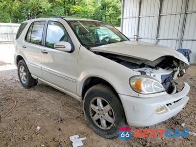 Czwarte zdjęcie samochodu z boku: 2003 MERCEDES-BENZ ML 500 VIN:4JGAB75E43A415649 - miniatura