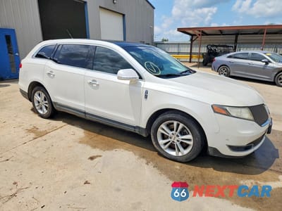 Czwarte zdjęcie samochodu z boku: 2014 LINCOLN MKT VIN:2LMHJ5AT7EBL55467 - miniatura