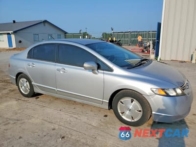 Czwarte zdjęcie samochodu z boku: 2006 HONDA CIVIC HYBRID VIN:JHMFA36256S002341 - miniatura