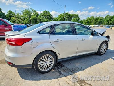 Trzecie zdjęcie samochodu z tyłu: 2018 FORD FOCUS TITANIUM VIN:1FADP3J22JL283960 - miniatura