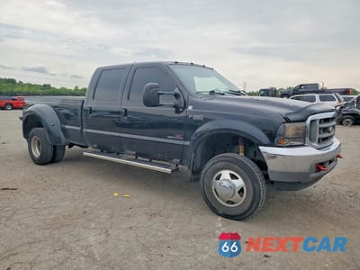 Czwarte zdjęcie samochodu z boku: 2001 FORD F350 SUPER DUTY VIN:1FTWW33F31EB40994 - miniatura