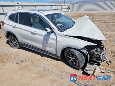 Czwarte zdjęcie samochodu z boku: 2017 BMW X1 SDRIVE28I VIN:WBXHU7C3XH5H36275 - miniatura