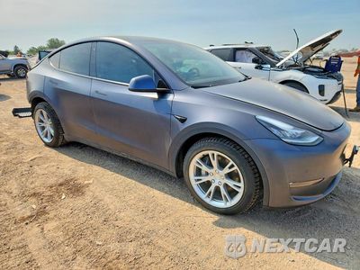 Czwarte zdjęcie samochodu z boku: 2021 TESLA MODEL Y VIN:5YJYGAEE0MF228239 - miniatura