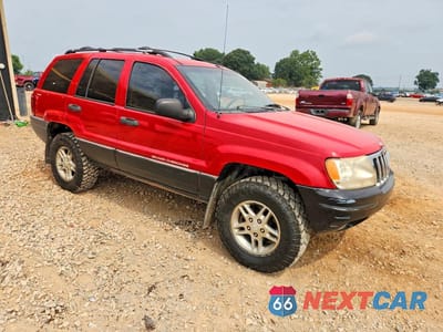 Czwarte zdjęcie samochodu z boku: 1999 JEEP GRAND CHEROKEE LAREDO VIN:1J4GW58S8XC588362 - miniatura