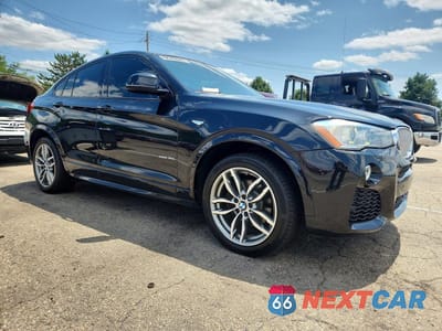Czwarte zdjęcie samochodu z boku: 2016 BMW X4 XDRIVE35I VIN:5UXXW5C5XG0N92775 - miniatura