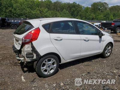 Trzecie zdjęcie samochodu z tyłu: 2014 FORD FIESTA SE VIN:3FADP4EJ3EM102716 - miniatura
