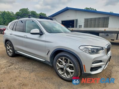 Czwarte zdjęcie samochodu z boku: 2021 BMW X3 XDRIVE30E VIN:5UXTS1C05M9F02501 - miniatura