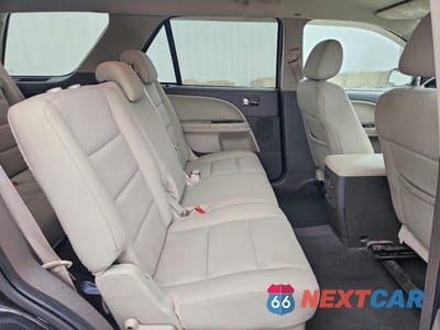 Zdjęcie 10 z 12 samochodu: 2009 FORD TAURUS X SEL VIN:1FMDK02W79GA02454 - miniatura