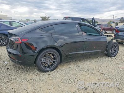 Trzecie zdjęcie samochodu z tyłu: 2023 TESLA MODEL 3 VIN:5YJ3E1EBXPF616704 - miniatura