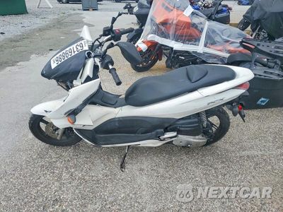 Trzecie zdjęcie samochodu z tyłu: 2011 HONDA PCX VIN:MLHJF2806B5002177 - miniatura