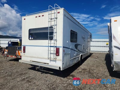Czwarte zdjęcie samochodu z boku: 2002 FORD ECONOLINE E450 SUPER DUTY CUTAWAY VAN VIN:1FDXE45S92HB31039 - miniatura